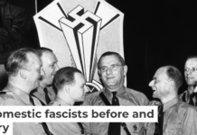 Fritz Kuhn, center, is congratulated by fellow officers of the German American Bund in New York on Sept. 3, 1938. AP Photo